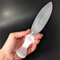 Thumbnail for Person holding Selenite 7.7’ Dagger #LV4135, a plastic knife for spiritual and decorative use