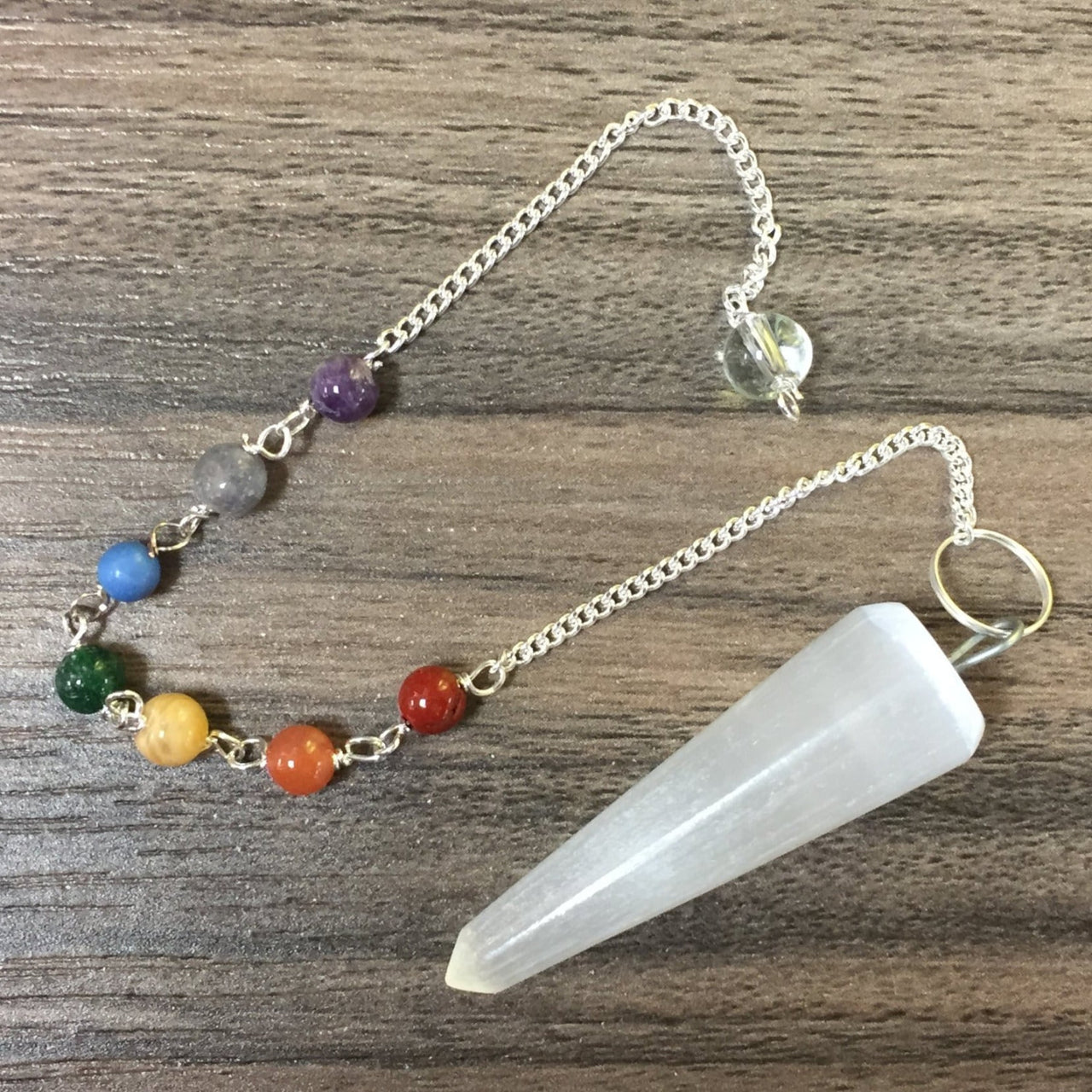 Selenite Pendulum with Chakra Chain J382 - Close-up of a pendant necklace