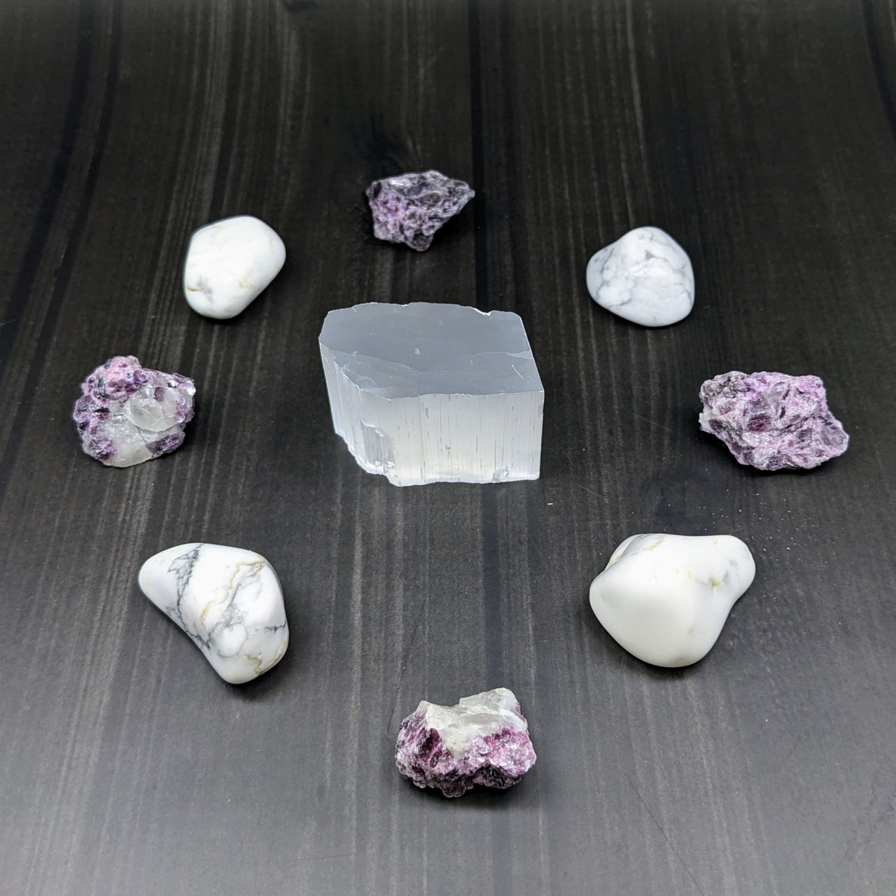 White and purple stone among crystals from Set of Stones for Sacred Crystal Grid for Restful Sleep