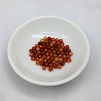 Thumbnail for White bowl of red beans next to Snakeskin Agate Faceted 4mm Bead Pack LV3662