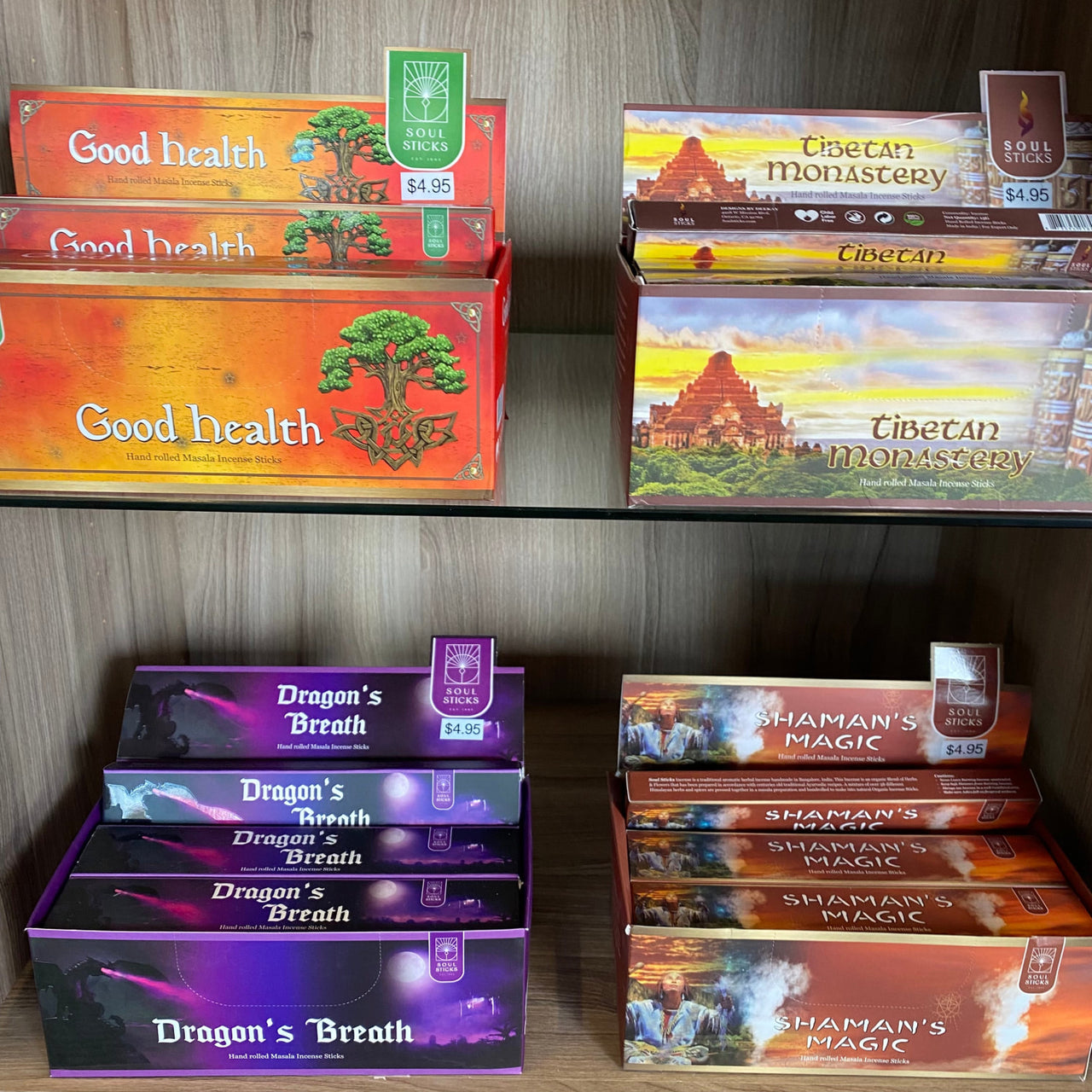 Shelf filled with game boxes next to Soul Sticks Natural Incense Stick #Q350