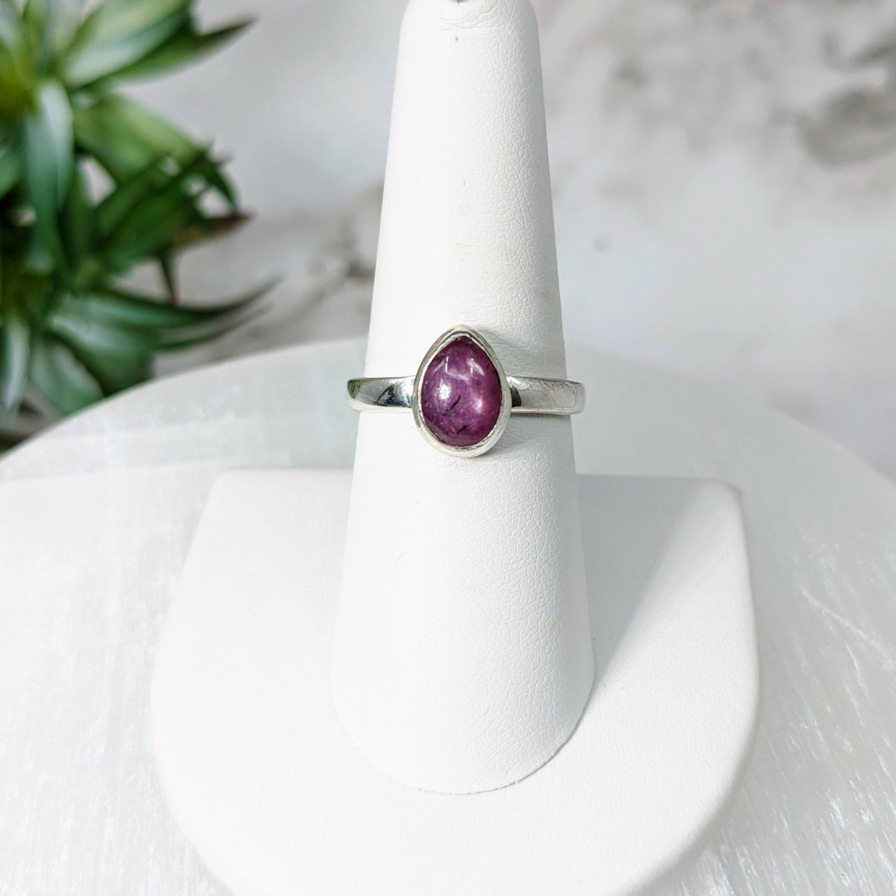 Elegant Star Ruby S.S. Teardrop Ring #LV5018 with a white gold band and purple stone