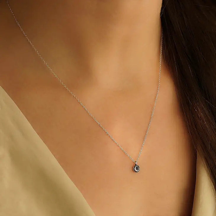 Woman wearing Sterling Silver Star and Moon Necklace #J047 with black diamond