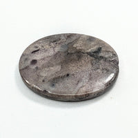 Thumbnail for Sugilite Rectangle Cabochon #C138 featuring a round metal object on a white surface