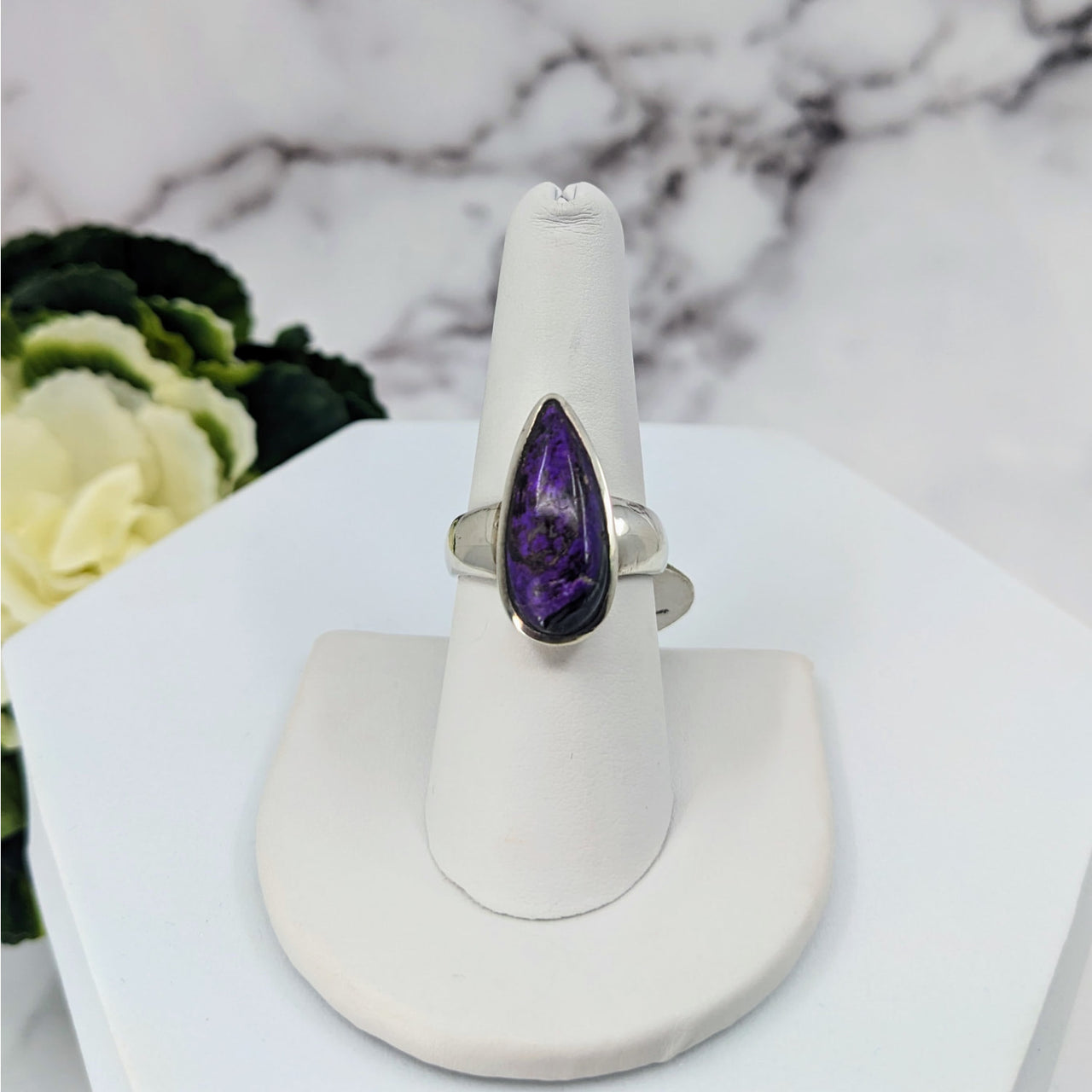 Sugilite Ring Size 7.75 Sterling Silver #LV3405 displayed on a white stand