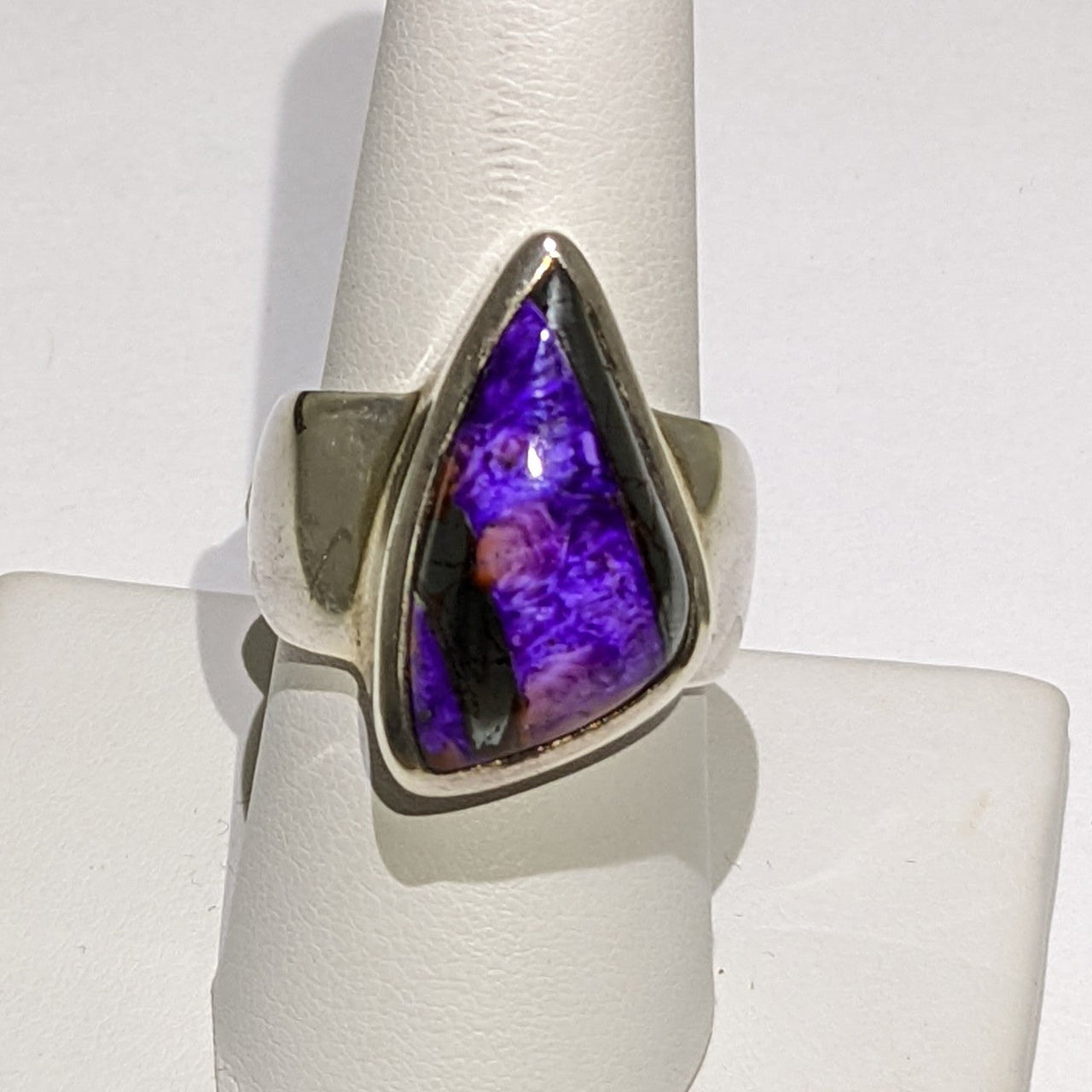 Sugilite Ring #J803 featuring a striking purple stone in an elegant setting