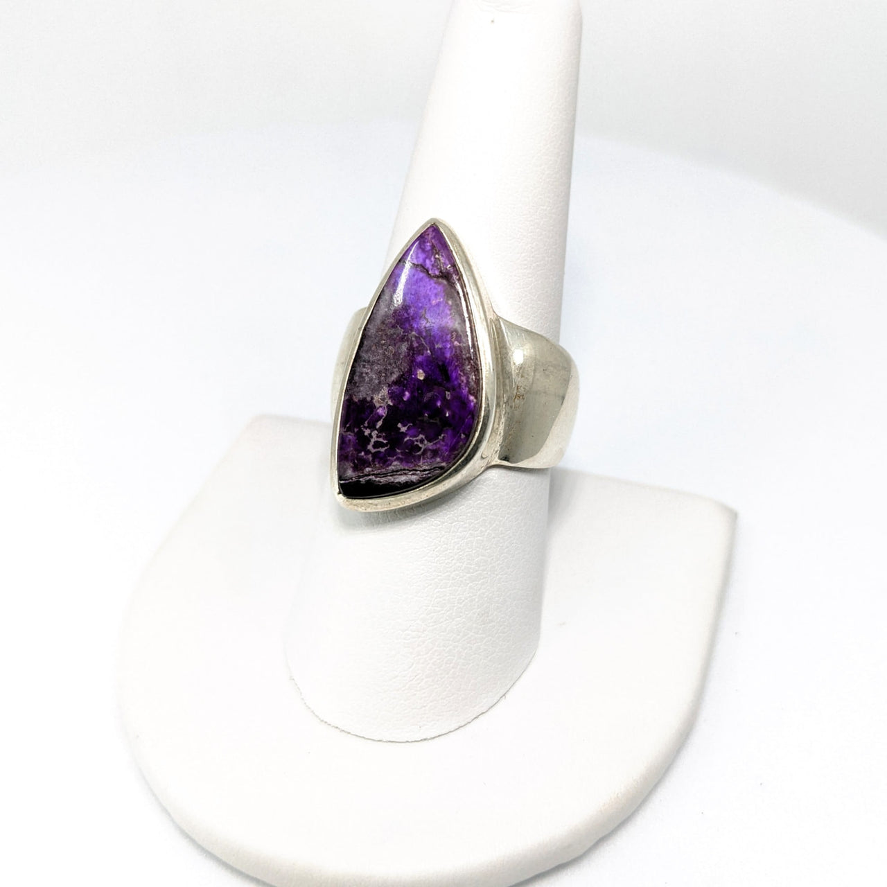 Sugilite SS ring size 8.25 (12g) #SK9356 on a white ring stand, featuring a purple stone