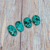 Thumbnail for Tibetan Turquoise 1.5’ Small Palm Stones #SK9939 displayed in a serene setting