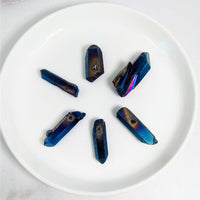 Thumbnail for White plate with five blue crystals from the Titanium Aura Quartz Point Bead #LV3605 pack