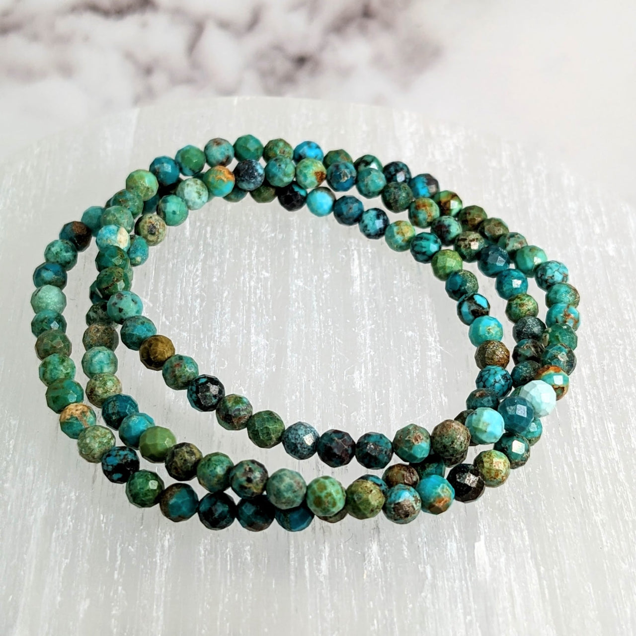 Turquoise green bracelet displayed for sale, product name: Turquoise 7’ Faceted 4mm Bracelet #LV2124