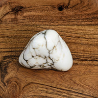 Thumbnail for White Howlite Jumbo 2.4’ Polished Nugget #LV2914 on a wooden surface