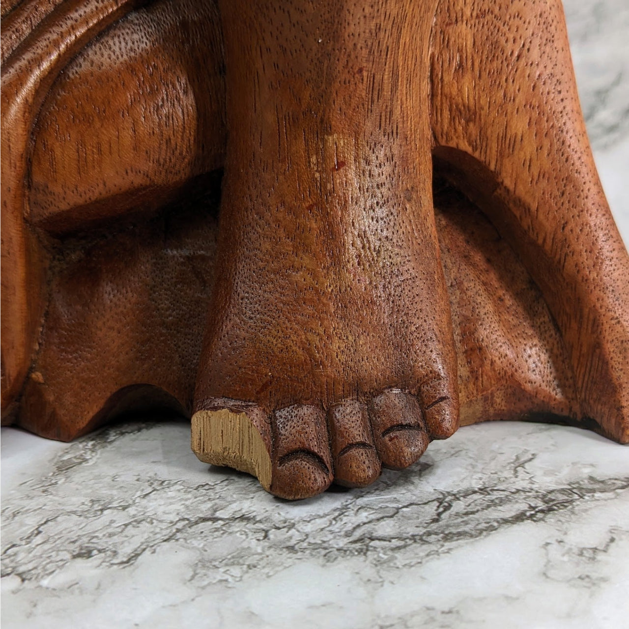 Wood Buddha 14’ Carving Statue with Small Defect - Wooden Elephant Head on Marble Surface